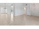 Spacious living area with tile flooring and open floor plan leading to kitchen and outdoor area at 36 Sand Dollar Dr, Ormond Beach, FL 32176