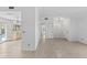 Open-concept living area with tile flooring, neutral walls, and modern lighting at 36 Sand Dollar Dr, Ormond Beach, FL 32176