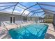 Outdoor pool with a screened enclosure and french doors leading to indoor entertainment areas at 36 Sand Dollar Dr, Ormond Beach, FL 32176