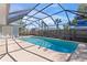 Inviting screened pool with stainless steel rails, and lots of deck space at 36 Sand Dollar Dr, Ormond Beach, FL 32176