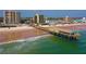 Aerial view of condo with beach, ocean, and pier views creating an inviting coastal appeal at 3647 S Atlantic Ave # 5B, Daytona Beach, FL 32118