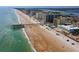 Gorgeous aerial view showcasing the beach, pier, and proximity to oceanfront condos at 3647 S Atlantic Ave # 5B, Daytona Beach, FL 32118