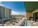 Relaxing balcony view overlooking the parking area, street, and distant scenery from this beachfront condo at 3647 S Atlantic Ave # 5B, Daytona Beach, FL 32118