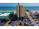 Condo building exterior with parking and a view of the ocean and pier at 3647 S Atlantic Ave # 5B, Daytona Beach, FL 32118