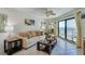 Bright and airy living room with ocean views, showcasing a cozy seating area at 3647 S Atlantic Ave # 5B, Daytona Beach, FL 32118