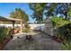 Tranquil backyard with a fire pit, shed, garden beds, and a cozy patio at 3825 Arborvitae Way, Deland, FL 32724