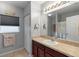 Well-lit bathroom includes a vanity with storage and a mirror at 3825 Arborvitae Way, Deland, FL 32724