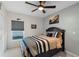 Well-lit bedroom featuring a ceiling fan and stylish decor at 3825 Arborvitae Way, Deland, FL 32724