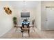 Bright dining room with elegant chandelier and plenty of natural light for Gathering meals at 3825 Arborvitae Way, Deland, FL 32724