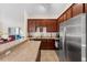 Well-equipped kitchen features stainless steel appliances and granite countertops for a modern touch at 3825 Arborvitae Way, Deland, FL 32724