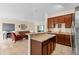 Open concept living area with a kitchen featuring a breakfast bar at 3825 Arborvitae Way, Deland, FL 32724
