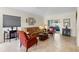 Inviting living room featuring comfortable seating and views of the outdoors at 3825 Arborvitae Way, Deland, FL 32724