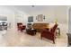 Cozy living room with comfortable seating and tile flooring, adjacent to the dining area at 3825 Arborvitae Way, Deland, FL 32724