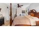 Comfortable main bedroom features a ceiling fan and natural light at 3825 Arborvitae Way, Deland, FL 32724