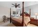 Comfortable main bedroom features a ceiling fan and natural light at 3825 Arborvitae Way, Deland, FL 32724