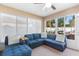 Relaxing sunroom with ample seating and plenty of natural light that provides tranquil views of backyard at 3825 Arborvitae Way, Deland, FL 32724