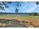 Picturesque lake view with clear blue water and scenic trees, offering a tranquil setting at 47 Spring Glen Dr, Debary, FL 32713