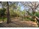 Wooden backyard deck with mature trees at 50 Lake Dr # 1/2, Debary, FL 32713