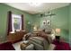 Bedroom features a bed, dresser, lamps, and decor, creating a cozy and stylish retreat at 50 Lake Dr # 1/2, Debary, FL 32713
