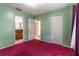 Bright bedroom with unique colors, closet, and bathroom access offer storage and convenience at 50 Lake Dr # 1/2, Debary, FL 32713