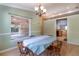Light-filled dining room featuring hardwood floors and view to the sunroom and kitchen at 50 Lake Dr # 1/2, Debary, FL 32713