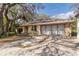 Charming brick home with attached two-car garage and mature landscaping at 50 Lake Dr # 1/2, Debary, FL 32713