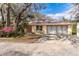 Charming brick home with attached two-car garage and mature landscaping at 50 Lake Dr # 1/2, Debary, FL 32713
