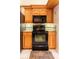 Well-equipped kitchen features modern appliances, light wood cabinets, and tile backsplash at 50 Lake Dr # 1/2, Debary, FL 32713