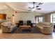 Open living room features a ceiling fan, vaulted ceilings, and lots of space at 50 Lake Dr # 1/2, Debary, FL 32713