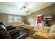 Cozy living room with hardwood floors, neutral paint, ceiling fan, and comfortable seating at 50 Lake Dr # 1/2, Debary, FL 32713