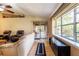 Bright living room features a sliding door, natural light and wood floors at 50 Lake Dr # 1/2, Debary, FL 32713