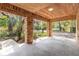 Covered patio surrounded by brick columns, offering views of the garden at 50 Lake Dr # 1/2, Debary, FL 32713