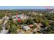 Aerial view of a home near Dunlawton Bridge featuring mature landscaping and a screened-in pool at 511 Powers Ave, Port Orange, FL 32127