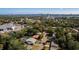 An aerial view of a quaint neighborhood near the Dunlawton Bridge featuring mature landscaping and a screened-in pool at 511 Powers Ave, Port Orange, FL 32127