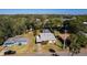 Aerial view of the property featuring a fenced pool area, lush yard, and mature palm trees at 511 Powers Ave, Port Orange, FL 32127