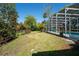 The backyard features a screened-in pool area with lush landscaping at 511 Powers Ave, Port Orange, FL 32127