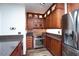Kitchen featuring granite countertops, stainless steel appliances, and custom cabinetry at 511 Powers Ave, Port Orange, FL 32127