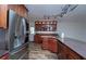 Eat-in kitchen featuring stainless steel appliances, granite counters, and custom cabinetry at 511 Powers Ave, Port Orange, FL 32127