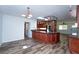 Spacious eat-in kitchen with granite counters, custom cabinets, and modern lighting at 511 Powers Ave, Port Orange, FL 32127
