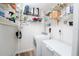 Convenient laundry area with shelving, washer, dryer, and storage space, ideal for organization at 511 Powers Ave, Port Orange, FL 32127