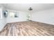 Bright living room with hardwood flooring, sliding glass doors and plenty of natural light at 511 Powers Ave, Port Orange, FL 32127