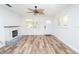 Bright living room featuring a fireplace, modern flooring, and natural light at 511 Powers Ave, Port Orange, FL 32127