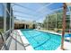 Screened-in pool with a slide, and the house in the background at 511 Powers Ave, Port Orange, FL 32127