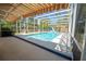 A screened-in pool and patio area with an awning at 511 Powers Ave, Port Orange, FL 32127