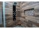 Luxurious shower with multi-jet system, decorative tile, and a built-in niche at 511 Powers Ave, Port Orange, FL 32127