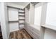 Spacious walk-in closet with custom shelving, drawers, and ample storage space at 511 Powers Ave, Port Orange, FL 32127