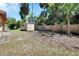 Spacious backyard featuring a storage shed and a wood fence providing privacy at 530 Taylor Dr, Orange City, FL 32763