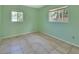 Cozy bedroom with two windows and tile flooring at 530 Taylor Dr, Orange City, FL 32763