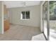 Eat-in kitchen area with door and sliding doors to backyard at 530 Taylor Dr, Orange City, FL 32763