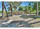 Single-story home featuring a mature landscaped yard, covered carport, and cozy front exterior at 530 Taylor Dr, Orange City, FL 32763